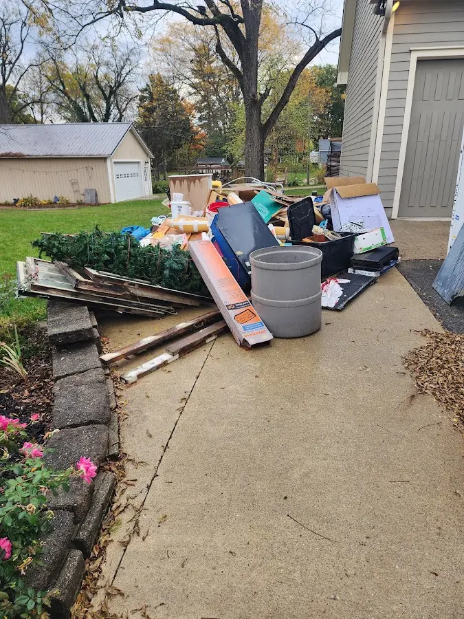 Dumpster being loaded with debris for Demolition Dumpster Rental in Pickens